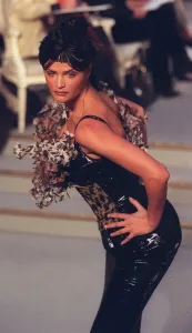 Women's Fashion Clothing Prints: Helena Christensen poses in a black corset from Dior at a Paris Fashion Week in 1997