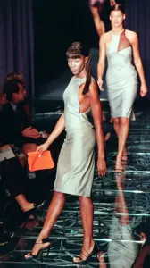 Supermodel Style Inspiration Prints: Naomi Campbell models one of the dresses from the first ever collection designed by