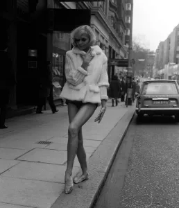 Fashionable Women's Coats Prints: Fashion Sixties 60s Beth Pauley wearing White Saga mink ski jacket with knitted