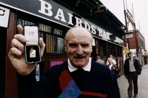 Lisbon Lions Prints: Willie O'Neill holding European Cup Medal Print