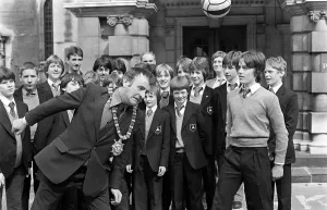 Prints of Deramore School Pupils Visit Belfast City Hall. On the ball with pupils of Deramore School, Belfast, is Lord Mayor Alderman John Carson Sport Prints: Deramore School Pupils Visit Belfast City Hall Print - 1980