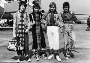 Prints of Bay City Rollers on the tarmac at Heathrow Airport. Left to right: Stuart Wood, Ian Mitchell, Derek Longmuir and Les McKeown. 17th April 1976 Heathrow Airport Prints: Bay City Rollers on Tarmac at Heathrow Airport Print 1976