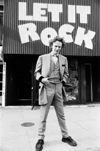 Prints of Teddy Boy Malcolm Mclaren outside his shop Let it Rock in the Kings Road, Chelsea, London. 14th March 1972 London Prints: Teddy Boy Malcolm McLaren outside Let it Rock, 14th March 1972 Print