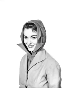 Fashionable Women's Coats Prints: Clothing: Fashion: Hats: Woman wearing hat and scarf combined. 1958