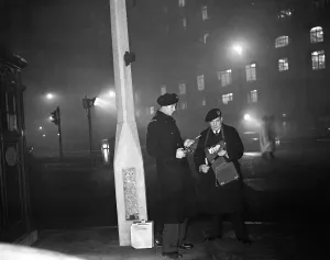 Prints of Smog wardens holding flares in thick fog in Central London. 5th January 1956 Weather Prints: Smog Wardens in Central London Print, 5th January 1956