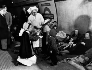 London Underground History Prints: Nurses giving tube shelterers Garole for prevention of flu as they take cover in at St