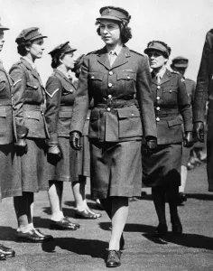 Prints of Queen Elizabeth II. Princess Elizabeth as Junior Commander in the ATS inspecting The Motor Transport Training Centre at Camberley, Surrey during the Second World War. Circa May 1945 0400to0499 Prints: Princess Elizabeth in ATS Uniform Print, May 1945