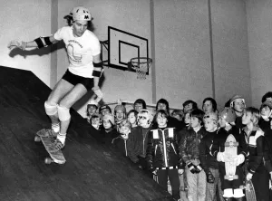 Youth Culture Images Prints: Mark Howard demonstrates his skateboarding skill to an appreciative audience at West