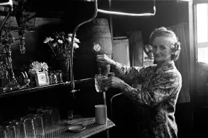 Vintage London Pubs Prints: Customers and staff at the Cider House on Harrow Road, London. Circa 1946