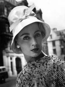 Retro Clothing Trends Prints: A woman modelling a fashionable hat. July 1957