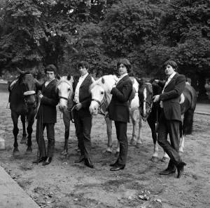 Prints of British rock group The Kinks pose on horses in the gardens opposite the Flaghouse in Charing Cross, London where they were rehearsing London Prints: The Kinks on Horses in Charing Cross Gardens Print 1964