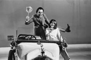 Sandie Shaw and Ken Dodd in 1912 Rover car, Didsbury, Manchester Print