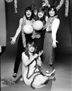 Prints of The Nolan Sisters left to right : Maureen Nolan, Bernie Nolan, Coleen Nolan with Linda Nolan on the floor Picture taken 9th December 1980 0800to0899 Prints: The Nolan Sisters Print - 9th December 1980