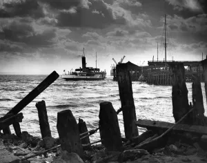 Prints of Framed by old timbers at Sammys Point, Hull, the New Holland ferry Wingfield Castle berths alongside the pontoon at Corporation Pier. 9th May 1961 Humberside Prints: Framed by Old Timbers at Sammys Point Print, 9th May 1961