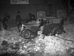 Prints of A Whirlwind tore and mauled its way across London, tossing people, roofs, cars and trees out of its path as it howls through the night sky Weather Prints: A Whirlwind tore through London, 8th December 1954 Print