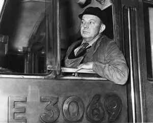 Prints of Train driver Tommy Heywood in the cab of his British Rail express Class 85 electric locomotive train, which ran on the newly electrified West Coast Main Line between Birmingham and Liverpool Railway Prints: British Rail Class 85 Electric Locomotive Print