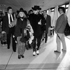 Prints of Elton John and Zandra Rhodes at Heathrow. 11th January 1981 Heathrow Airport Prints: Elton John and Zandra Rhodes at Heathrow Print 1981