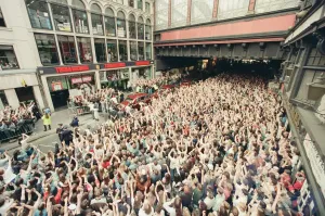 Prints of Bon Jovi, appearing at Tower Records, Argyle Street, Glasgow, Scotland. They played an acoustic set in the 2nd floor window to 5, 000 screaming fans below Pop Art Prints: Bon Jovi at Tower Records, Glasgow Print 1995