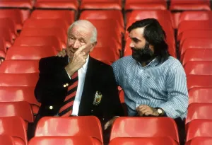 Prints of SIR MATT BUSBY AND GEORGE BEST SEATED IN FOOTBALL STANDS OF OLD TRAFFORD.2/10/90 Manchester Prints: Sir Matt Busby and George Best Print: Old Trafford Scene