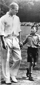 Duke Of Edinburgh Prints: 1950s Print of Prince Philip with a Child