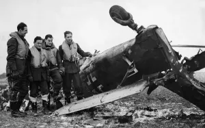 RAF Fighter Command Prints: Spitfire pilots of RAF Fighter Command pose beside the wreckage of a Junkers Ju 87 Stuka