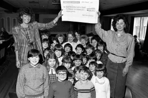 Miss Examiner Madeleine Garbutt (left) is presented with a £1 Miss Examiner Madeleine Garbutt (left) is presented with a £1