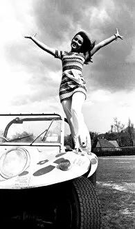 Images Dated 1st April 1970: A model in a beach buggy wearing a dress in April 1970