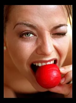 Images Dated 9th March 1998: Model eating plum March 1998