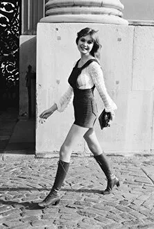 Images Dated 17th February 1971: Model and horror film actress Madeline Smith poses wearing hot pants suit with knee high