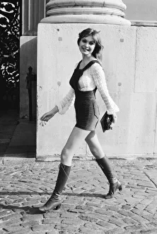 Images Dated 17th February 1971: Model and horror film actress Madeline Smith poses wearing hot pants suit with knee high