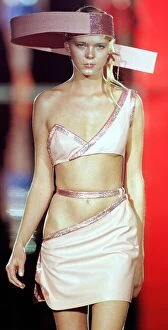 Images Dated 20th January 1999: A model pink dress with cut outs and strange hat designed by Paco Rabanne for his 1999