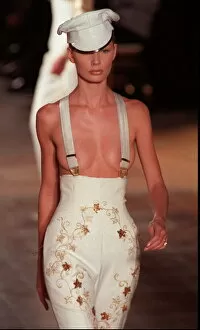 Images Dated 16th March 1997: A model walks down the catwalk wearing Givenchy in Paris - patterened tight trousers