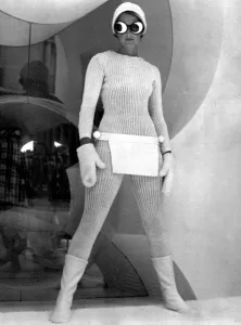 Model wearing knitted all in one suit with joke goggles and woolly hat Model wearing knitted all in one suit with joke goggles and woolly hat