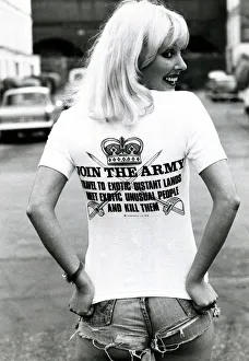 A model wearing a t-shirt with a controversial slogan in a London street August 1976 A model wearing a t-shirt with a controversial slogan in a London street August 1976
