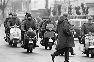 00573 Gallery: Mods on their scooters seen here driving along Clacton sea front