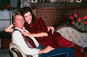 00192 Gallery: Morgan Brittany actress July 1983 sitting on couch with her husband