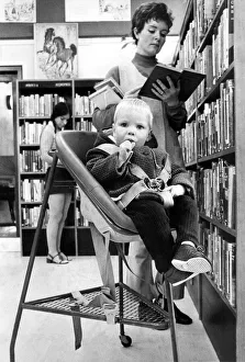 Both mother and child are getting on well with the new library push trolley so there will Both mother and child are getting on well with the new library push trolley so there will