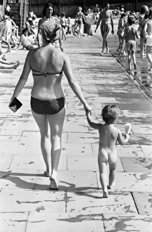 Mother and child try to keep cool at a Birmingham lido during the summer heatwave of 1976 Mother and child try to keep cool at a Birmingham lido during the summer heatwave of 1976