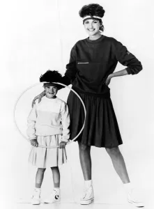 Mother and daughter wearing matching sweat shirts and full skirts by Jeffrey Rogers Mother and daughter wearing matching sweat shirts and full skirts by Jeffrey Rogers