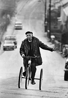Mr Booyer on his 87 year old tricycle riding through the streets of Bedwas, Wales Mr Booyer on his 87 year old tricycle riding through the streets of Bedwas, Wales