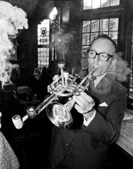Images Dated 14th November 2011: Mr Brian Cole winner of the Remarkable Pipe Contest seen here smoking / playing his