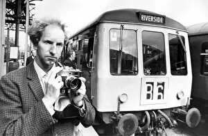 Mr. Graham Hague from Sheffield who is a railway enthusiast taking pictures of a Diesel