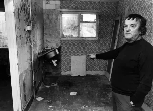 Knowsley Gallery: Mr John McGuire points to flood damage to his kitchen. Tower Hill Estate, Kirkby