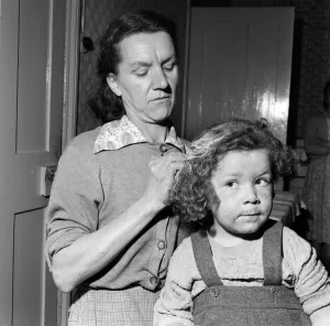 Mrs Gladys Batt attempting to clean her four-year-old daughter Georgina of paint Mrs Gladys Batt attempting to clean her four-year-old daughter Georgina of paint