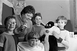 00714 Gallery: Mrs Janet Durkin gives hair-colouring treats to youngsters at Marsden playgroup'