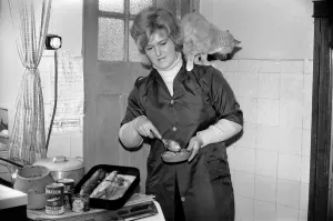 Mrs. Marlene Harris seen here preparing lunch for, cats Suki Mrs. Marlene Harris seen here preparing lunch for, cats Suki