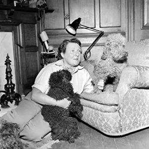 00068 Gallery: Mrs. Moss seen here with her dogs. 1954 A145b-001