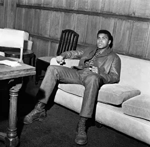 Portrait Posed Gallery: Muhammad Ali aka (Cassius Clay) relaxing in his suite at the Piccadilly Hotel London