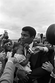 Muhammad Ali arrives at Teesside Airport with his family. July 1977 Muhammad Ali arrives at Teesside Airport with his family. July 1977