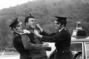 Muhammad Ali messing around with two policeman in Dublin prior to his fight with Alvin Muhammad Ali messing around with two policeman in Dublin prior to his fight with Alvin